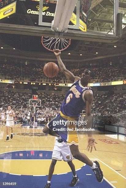 Guard Eddie Jones of the Los Angeles Lakers slam dunks the ball during a game against the Golden State Warriors at the San Jose Arena in San Jose,...