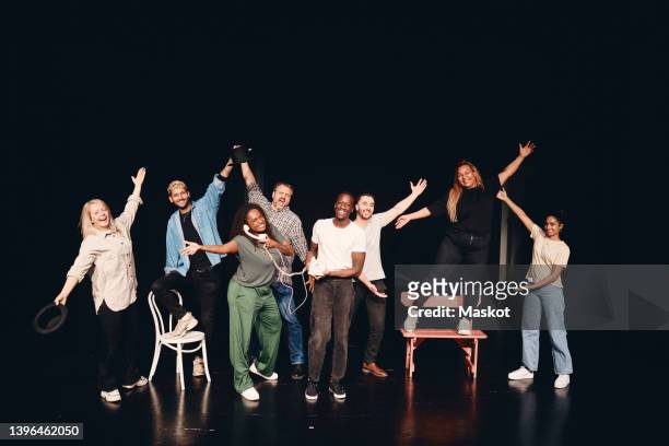 full length portrait of happy artists together on stage - acting fotografías e imágenes de stock