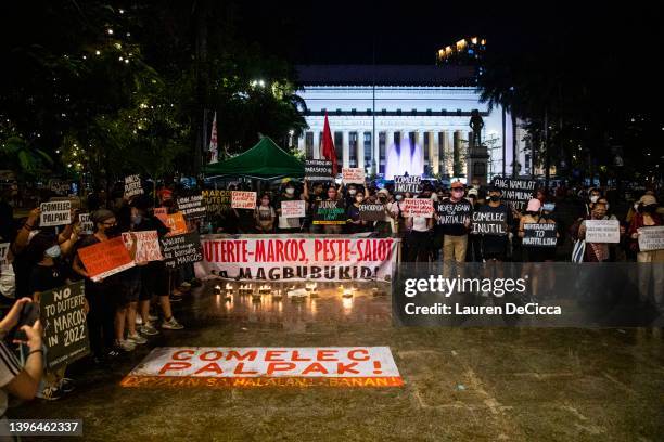 Anti Marcos and Duterte protesters hold a vigil in Liwasan Bonifacio Park on May 10, 2022 in Manila, Philippines. Ferdinand "Bongbong" Marcos Jr. Is...