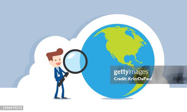 businessman holding magnifying glass searching earth - guy holding tablet device stock illustrations
