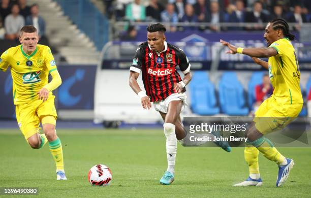 Hicham Boudaoui of Nice between Quentin Merlin, Samuel Moutoussamy of Nantes during the French Cup Final between OGC Nice and FC Nantes at Stade de...