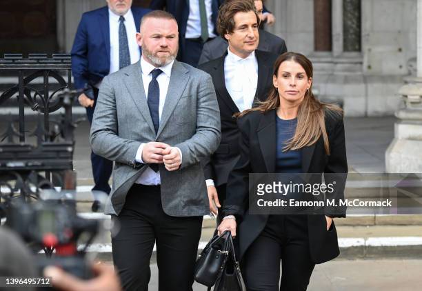 Wayne Rooney and Coleen Rooney depart the Royal Courts of Justice, Strand on May 10, 2022 in London, England. Coleen Rooney, wife Derby County...