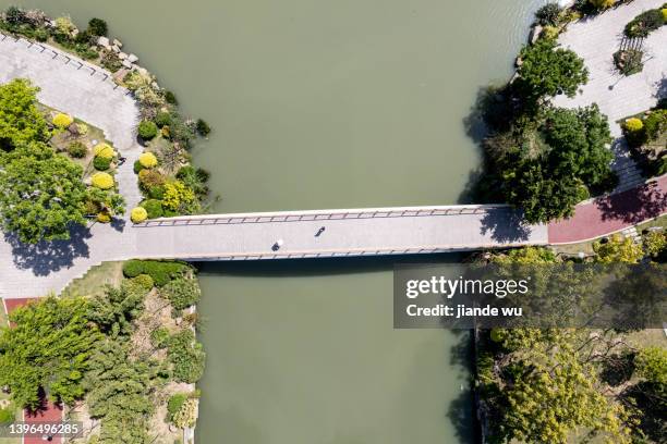 uav aerial photography - garden bridge stock-fotos und bilder