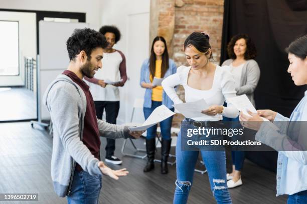 thespians stand in a small group - film director asian stock pictures, royalty-free photos & images