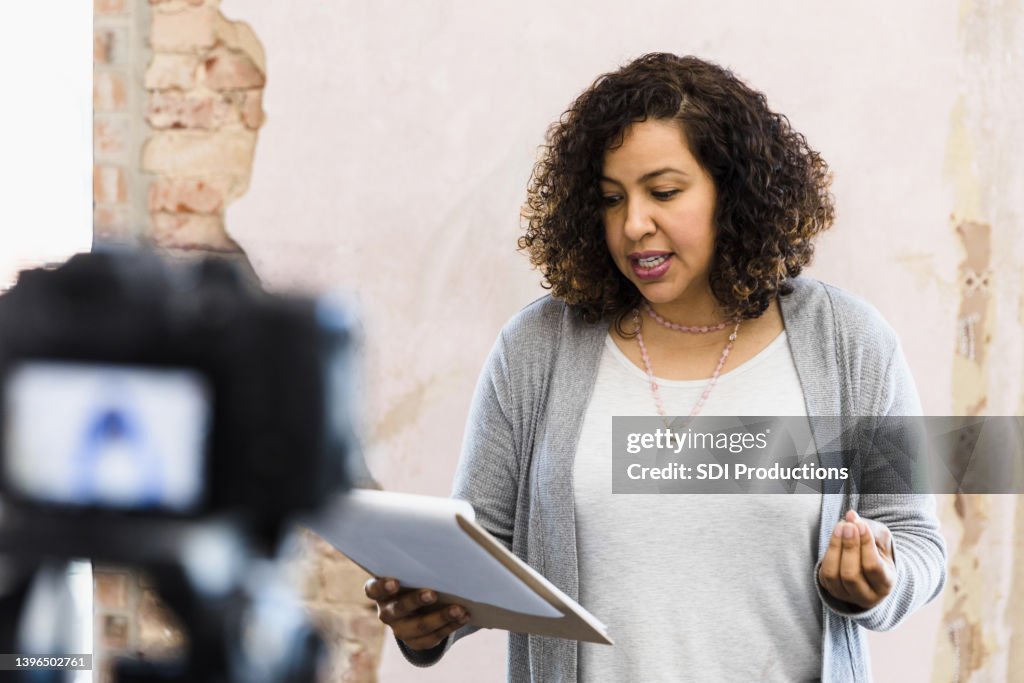 Young adult woman stands in front of the camera to audition