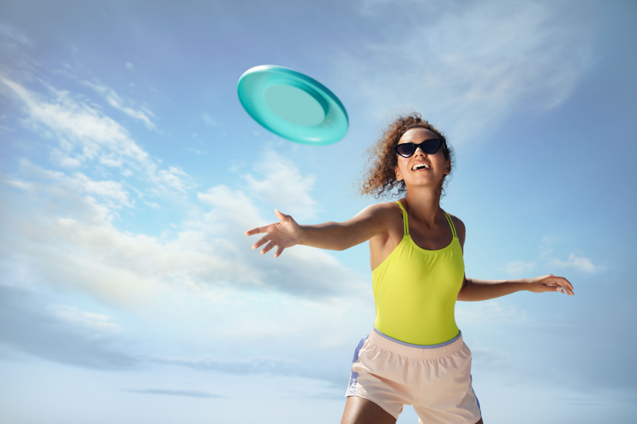 playing frisbee beach