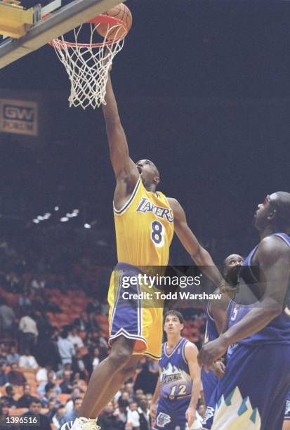 Guard Kobe Bryant of the Los Angeles Lakers lays up the ball during a game against the Utah Jazz at the Great Western Forum in Inglewood, California....