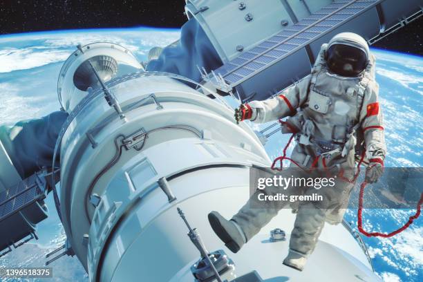 chinese astronaut over the main module tianhe on the space station tiangong - astronaut bildbanksfoton och bilder