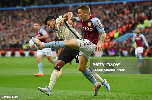 Lucas Digne of Aston Villa is challenged by Luis Diaz of Liverpool during the Premier League match between Aston Villa and Liverpool at Villa Park on...