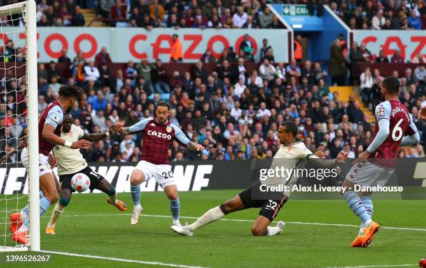 Joel Matip of Liverpool scores their first goal during the Premier League match between Aston Villa and Liverpool at Villa Park on May 10, 2022 in...