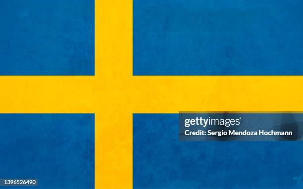 flag of sweden with a grunge texture - swedish flag stock pictures, royalty-free photos & images