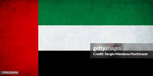 flag of united arab emirates, uae, with a grunge texture - emirates flag stock-fotos und bilder