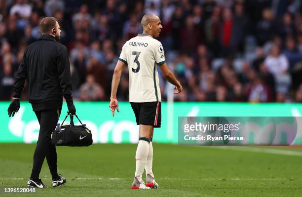 Fabinho of Liverpool leaves the pitch after being substituted due to an injury during the Premier League match between Aston Villa and Liverpool at...