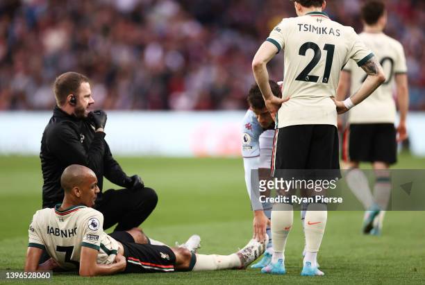Fabinho of Liverpool receives medical treatment during the Premier League match between Aston Villa and Liverpool at Villa Park on May 10, 2022 in...