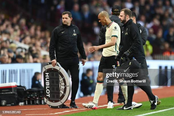 Fabinho of Liverpool leaves the pitch after being substituted due to an injury during the Premier League match between Aston Villa and Liverpool at...