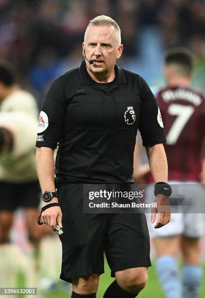 Referee Jonathan Moss looks on during the Premier League match between Aston Villa and Liverpool at Villa Park on May 10, 2022 in Birmingham, England.