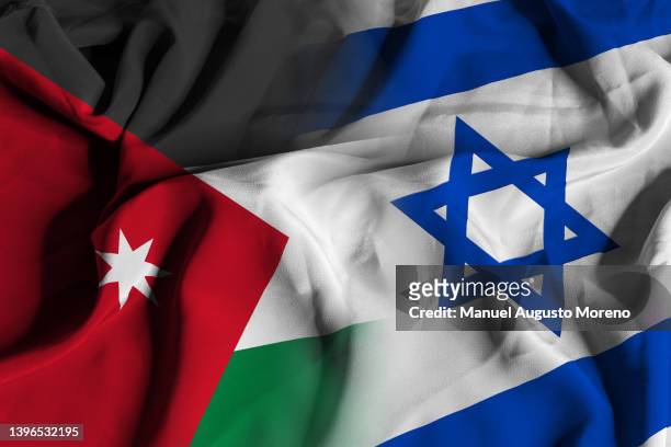flags of jordan and israel - jordan dinars foto e immagini stock