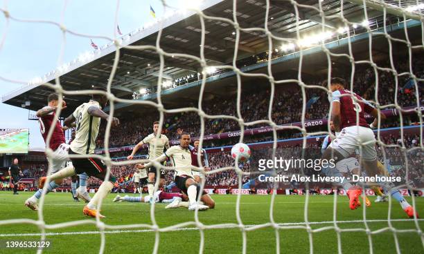 Joel Matip of Liverpool scores their first goal during the Premier League match between Aston Villa and Liverpool at Villa Park on May 10, 2022 in...