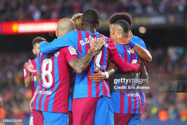 Memphis Depay FC Barcelona celebrates scoring his side's first goal with his team mates during the La Liga Santader match between FC Barcelona and RC...