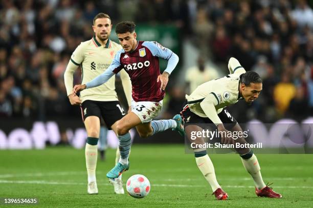 Philippe Coutinho of Aston Villa is challenged by Virgil van Dijk of Liverpool during the Premier League match between Aston Villa and Liverpool at...