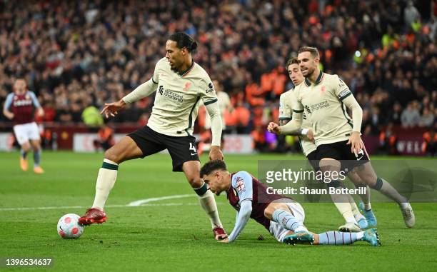 Philippe Coutinho of Aston Villa is challenged by Virgil van Dijk of Liverpool during the Premier League match between Aston Villa and Liverpool at...