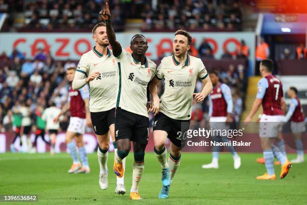 Sadio Mane celebrates with teammates Jordan Henderson and Diogo Jota of Liverpool after scoring their team's second goal during the Premier League...