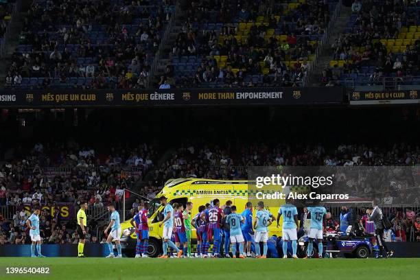 Ambulance is seen in the pitch giving medical attention to Ronald Araujo of FC Barcelona during the La Liga Santander match between FC Barcelona and...