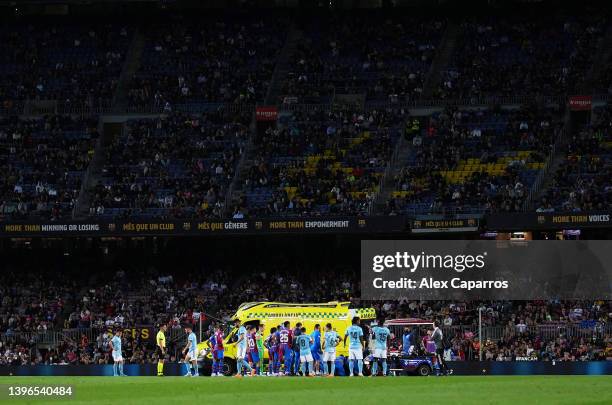 Ambulance is seen in the pitch giving medical attention to Ronald Araujo of FC Barcelona during the La Liga Santander match between FC Barcelona and...