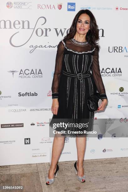 Maria Grazia Cucinotta attends the "Women For Women Against Violence - Camomilla Award" photocall on May 10, 2022 in Rome, Italy.