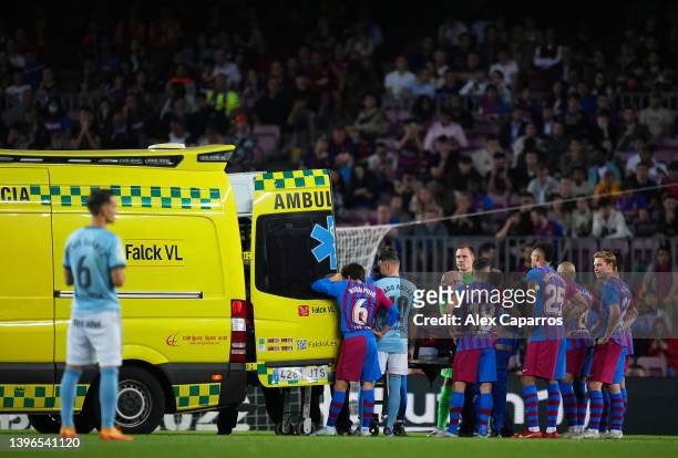 Players of FC Barcelona react as Ronald Araujo of FC Barcelona is taken off the pitch by a ambulance during the La Liga Santander match between FC...