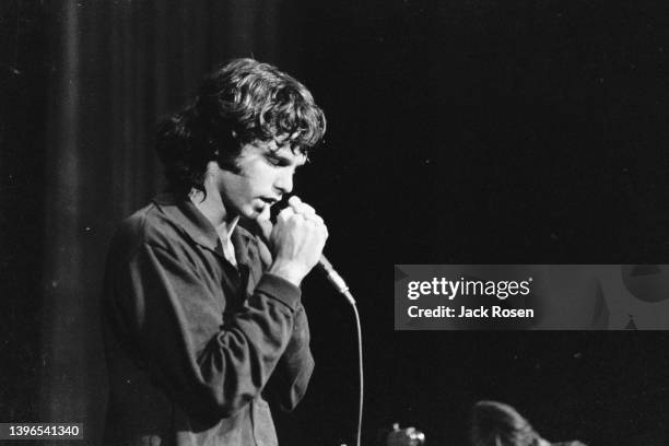 American Rock singer Jim Morrison , of the group the Doors, performs onstage at Town Hall, Philadelphia, Pennsylvania, June 18, 1967.