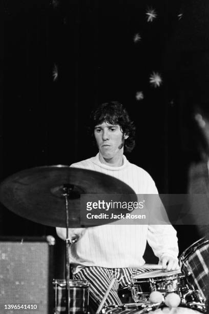 American Rock musician John Densmore, of the group the Doors, plays drums as he performs onstage at Town Hall, Philadelphia, Pennsylvania, June 18,...