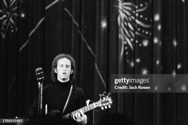 American Rock musician Robby Krieger, of the group the Doors, plays guitar as he performs onstage at Town Hall, Philadelphia, Pennsylvania, June 18,...