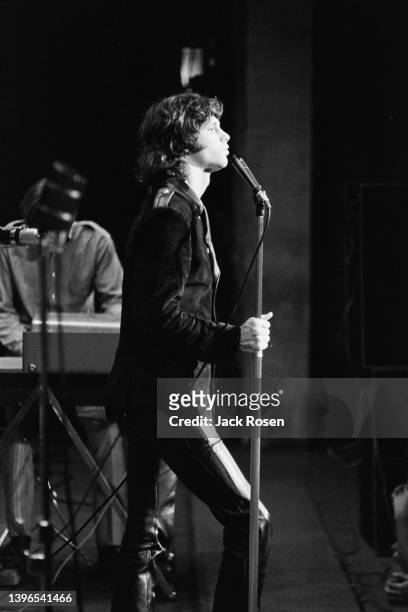 American Rock singer Jim Morrison , of the group the Doors, performs onstage at Town Hall, Philadelphia, Pennsylvania, June 18, 1967. Partially...
