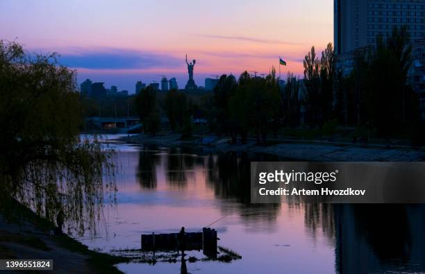 scenic view of dnipro river harbor at late evening, dusk. vivid  cool - warm colors - kyiv spring stock pictures, royalty-free photos & images