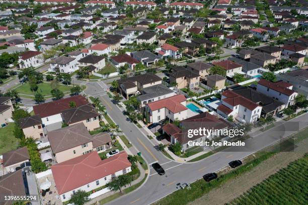 In an aerial view, single family homes are shown in a residential neighborhood on May 10, 2022 in Miami, Florida. New published data has hinted at...