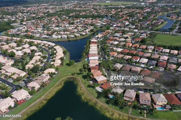 In an aerial view, single family homes are shown in a residential neighborhood on May 10, 2022 in Miami, Florida. New published data has hinted at...