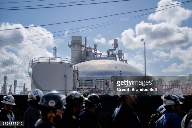 Workers exit the Marathon Galveston Bay Refinery on May 10, 2022 in Texas City, Texas. Texas added approximately 4,000 oil field service jobs in...