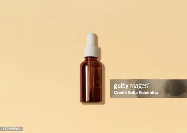 serum. photo in minimal style. - dropper bottle stock pictures, royalty-free photos & images