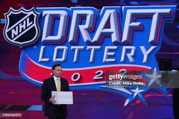 Scott Clarke of Ernst & Young walks in the draft positions during the 2022 NHL Draft Lottery on May 10, 2022 at the NHL Network's studio in Secaucus,...