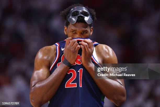 Joel Embiid of the Philadelphia 76ers reacts against the Miami Heat during the first half in Game Five of the Eastern Conference Semifinals at FTX...