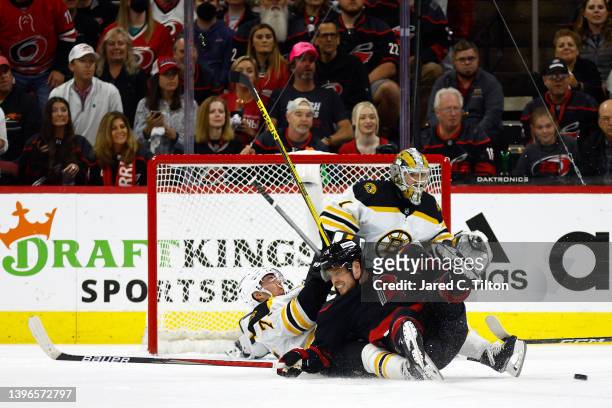Max Domi of the Carolina Hurricanes and Connor Clifton of the Boston Bruins battle in front of the net during the first period in Game Five of the...