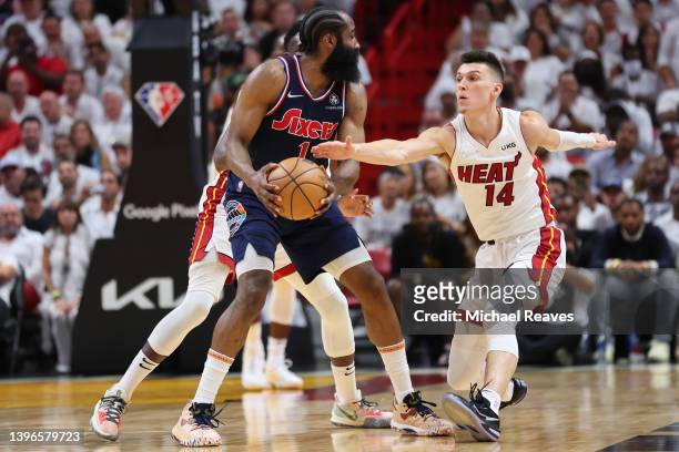 Tyler Herro of the Miami Heat attempts to steal the ball from James Harden of the Philadelphia 76ers during the second half in Game Five of the...