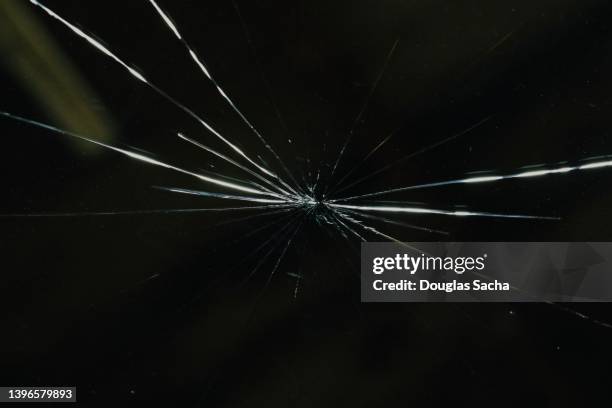 broken glass on a vehicle windshield - rotto foto e immagini stock