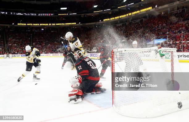 Antti Raanta of the Carolina Hurricanes makes a first period save against Chris Wagner of the Boston Bruins in Game Five of the First Round of the...
