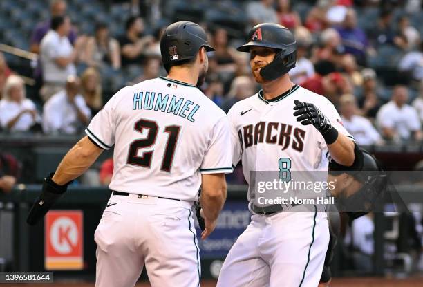 Jordan Luplow of the Arizona Diamondbacks celebrates with Cooper Hummel after hitting a two run home run off of Jesus Luzardo of the Miami Marlins...