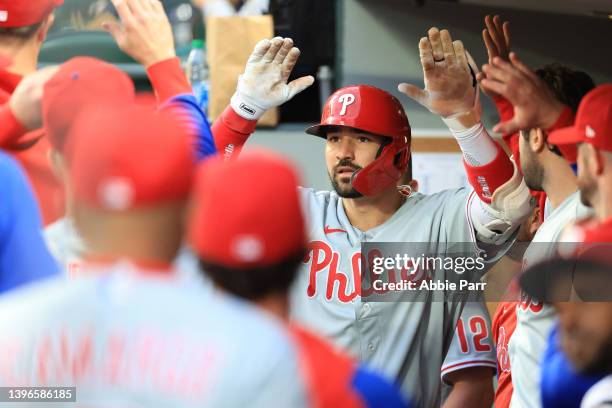 Nick Castellanos of the Philadelphia Phillies celebrates in the dugout after hitting a solo home run against the Seattle Mariners during the fifth...