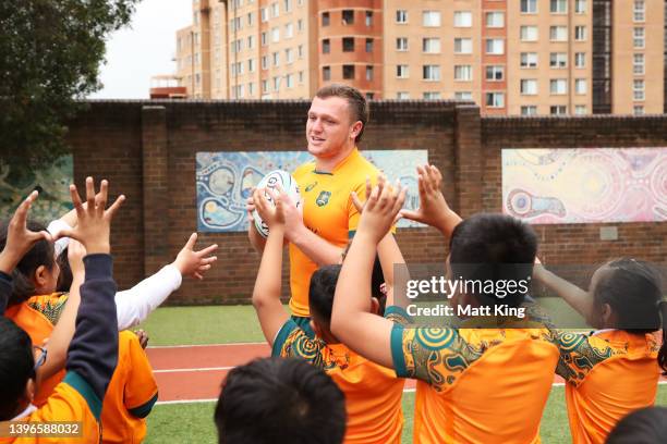 Angus Bell of the Wallabies interacts with school children during a media opportunity as the Wallabies unveil their 2022 International jersey at St...