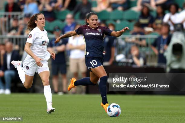 Debinha of the North Carolina Courage is chased by Kelley O'Hara of the Washington Spirit during the NWSL Challenge Cup Final between Washington...
