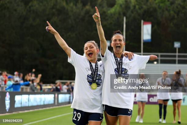 Rylee Baisden and Carson Pickett of the North Carolina Courage celebrate while taking a lap of honor after the NWSL Challenge Cup Final between...